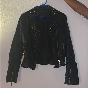 Black leather jacket with gold spikes